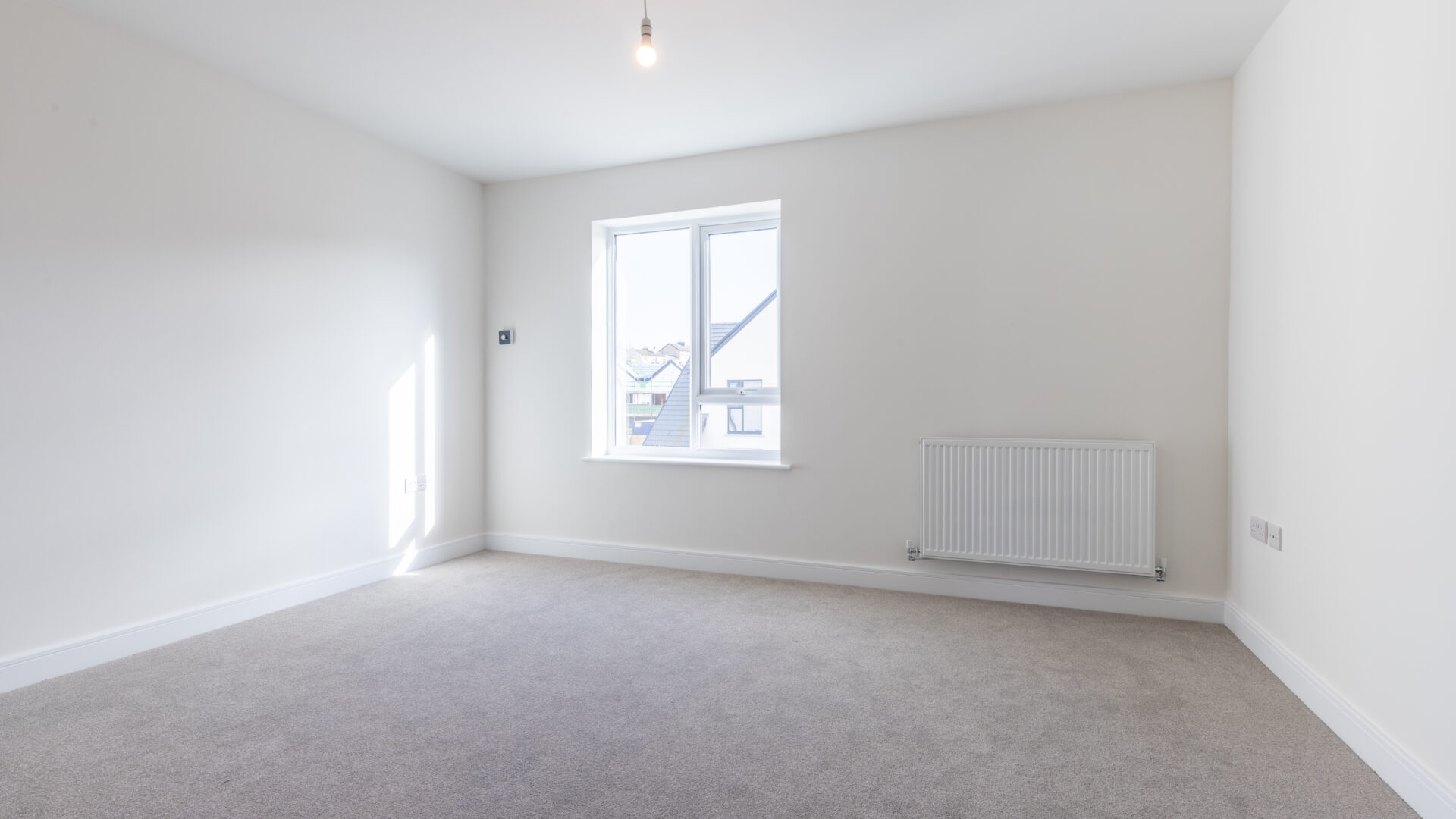 The master bedroom with en-suite bathroom in The Lindale, new build home at Meadow Rigg in Kendal - Genesis Homes