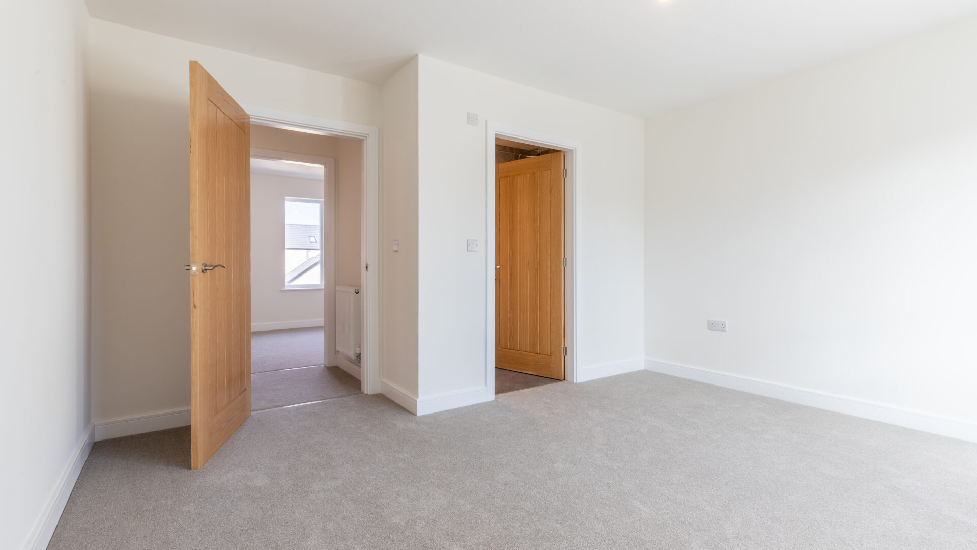 The master bedroom with en-suite bathroom in The Lindale, new build home at Meadow Rigg in Kendal - Genesis Homes