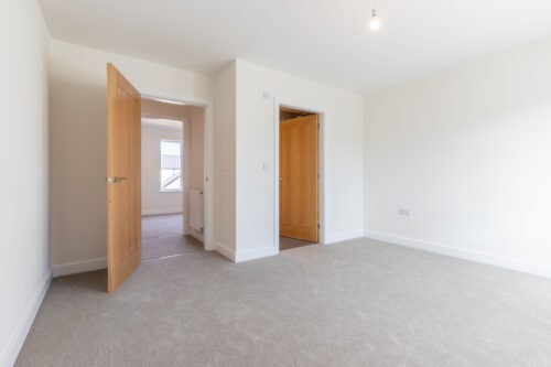 The master bedroom with en-suite bathroom in The Lindale, new build home at Meadow Rigg in Kendal - Genesis Homes