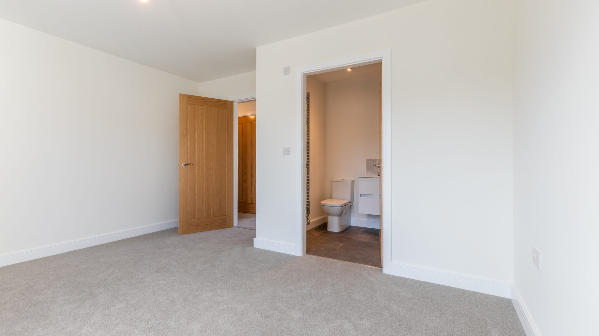 The master bedroom with en-suite bathroom in The Lindale, new build home at Meadow Rigg in Kendal - Genesis Homes