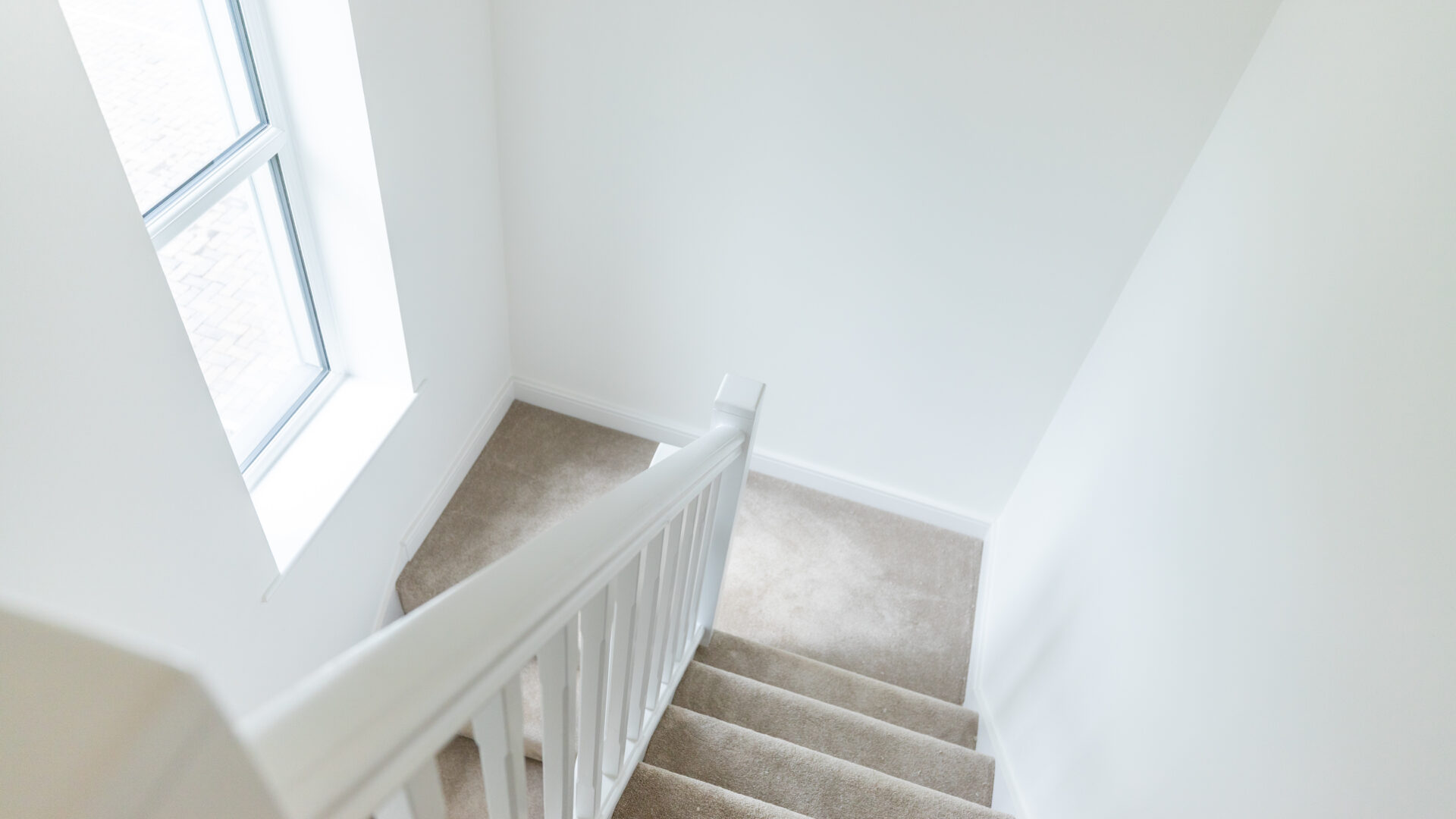 The Aspley staircase with feature window - new build home, Russell Armer by Genesis Homes