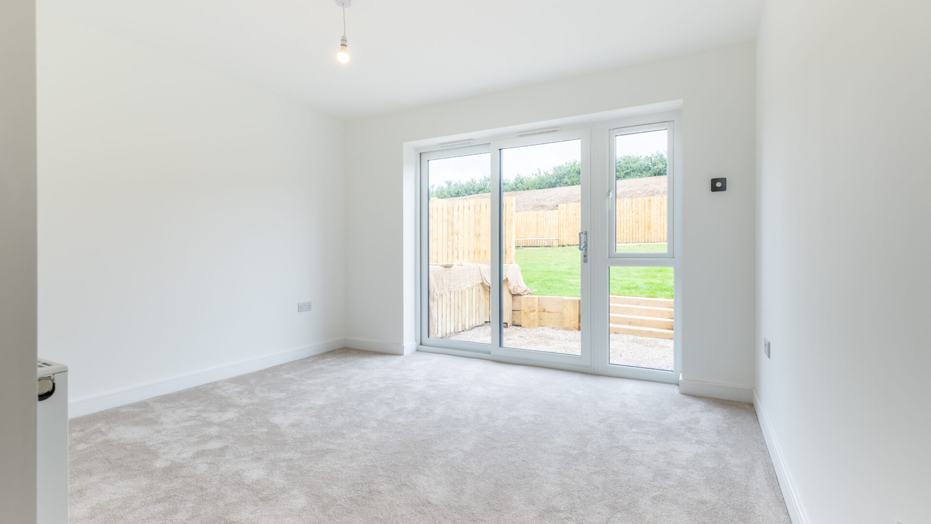 The Aspley master bedroom with sliding doors - new build home, Russell Armer by Genesis Homes