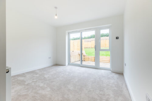The Aspley master bedroom with sliding doors - new build home, Russell Armer by Genesis Homes