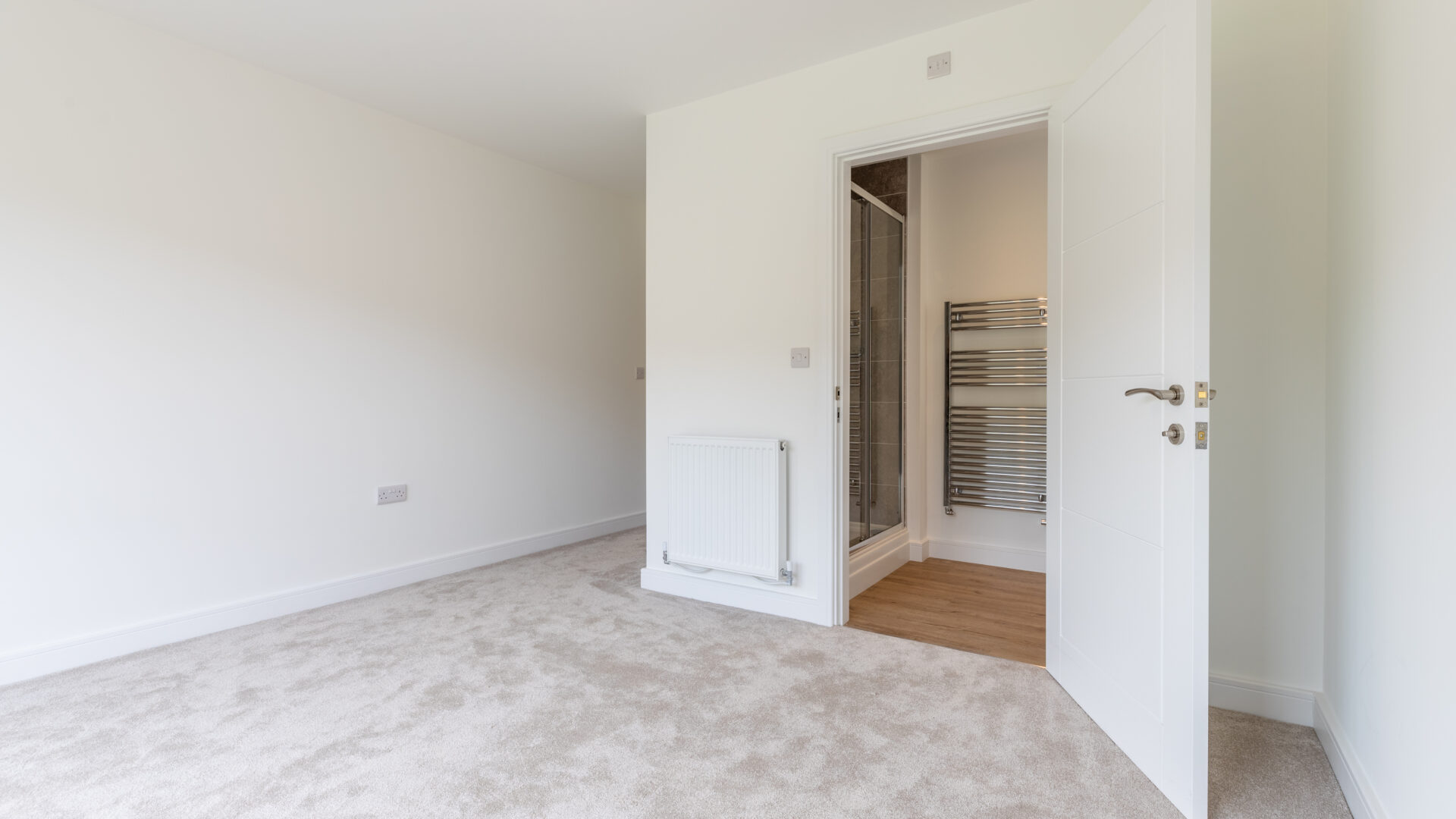 The Aspley master bedroom with en-suite bathroom - new build home, Russell Armer by Genesis Homes