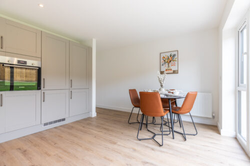 The Aspley kitchen/dining area - new build home, Russell Armer by Genesis Homes