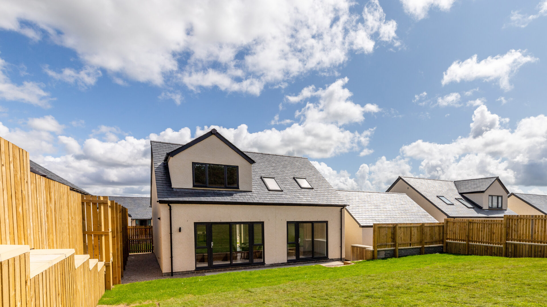 The Aspley exterior and rear garden - Russell Armer by Genesis Homes