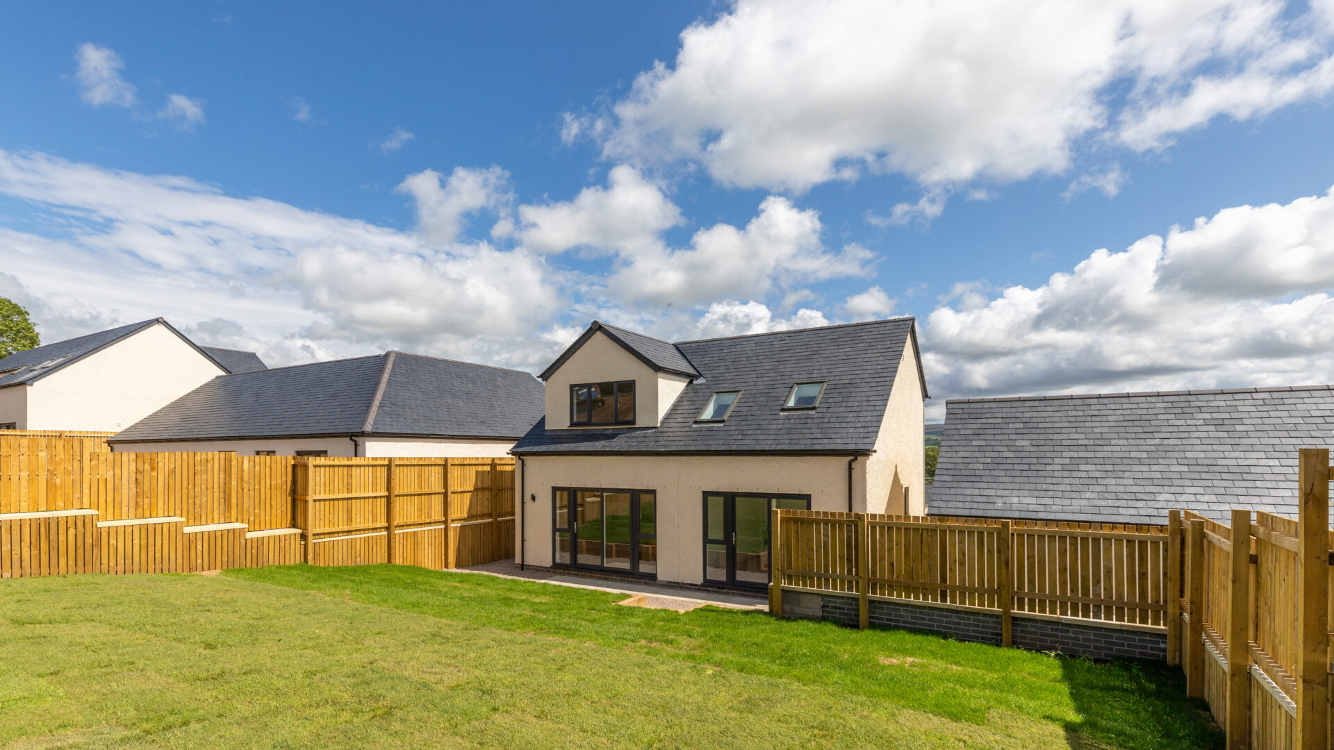 The Aspley exterior and rear garden - Russell Armer by Genesis Homes