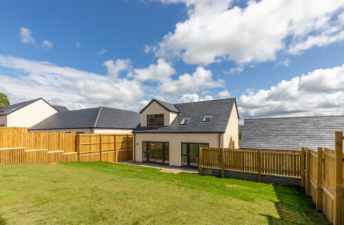 The Aspley exterior and rear garden - Russell Armer by Genesis Homes