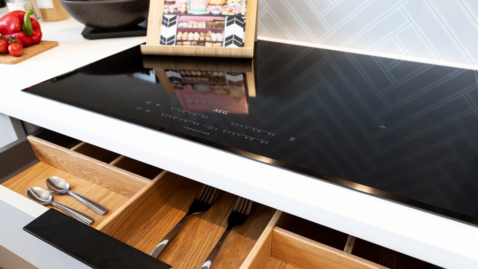 AEG induction hob in a Genesis Homes kitchen