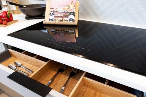AEG induction hob in a Genesis Homes kitchen