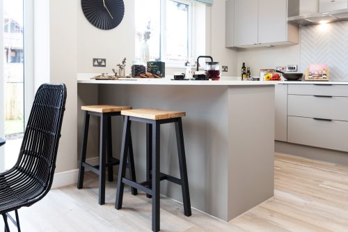 Modern kitchen with breakfast bar in a Genesis Homes new build house