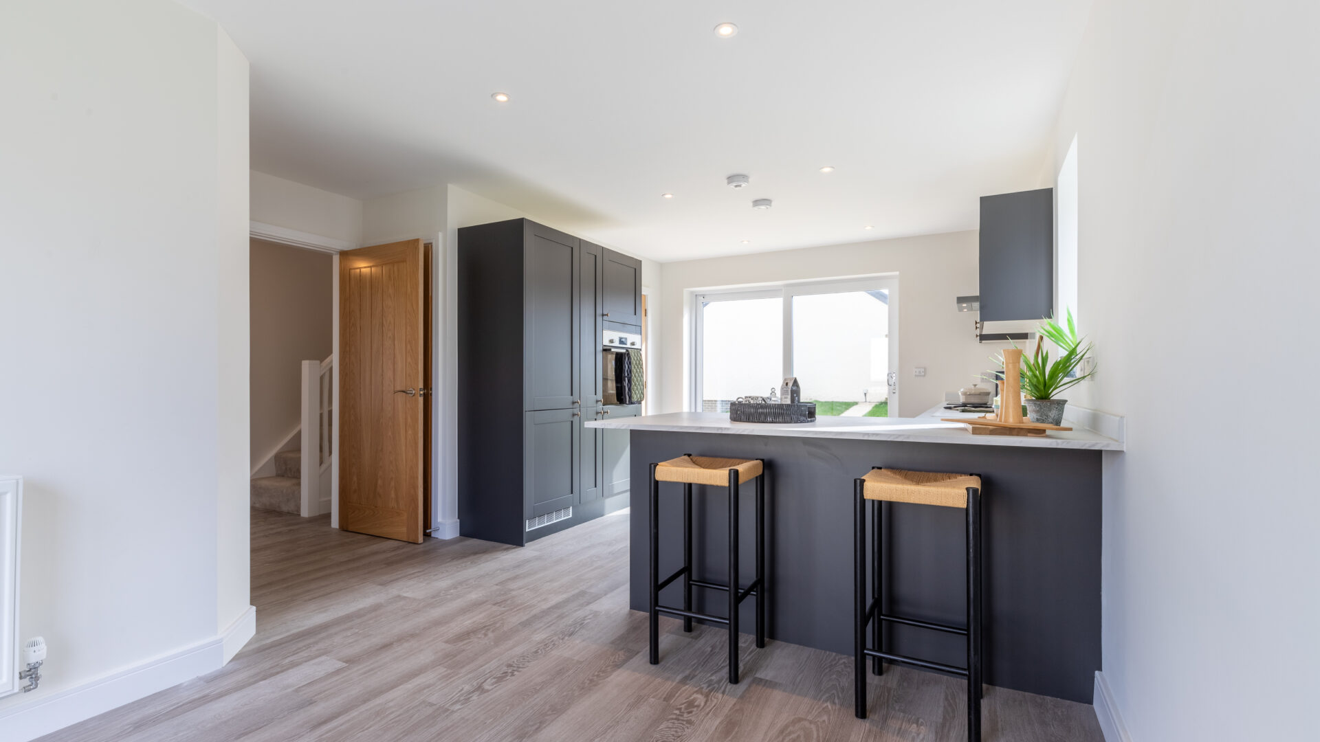 The open plan kitchen/dining area in the 3-bedroom Sedgwick at Meadow Rigg in Kendal - Genesis Homes