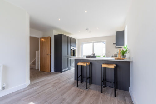 The open plan kitchen/dining area in the 3-bedroom Sedgwick at Meadow Rigg in Kendal - Genesis Homes