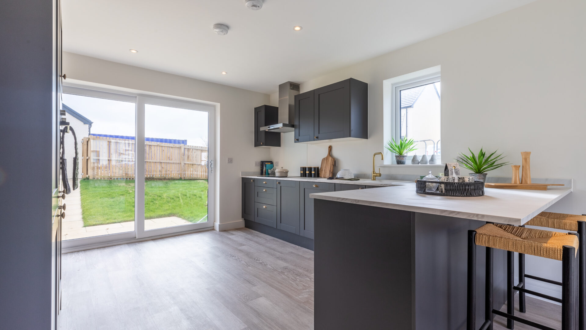 The open plan kitchen/dining area in the 3-bedroom Sedgwick at Meadow Rigg in Kendal - Genesis Homes