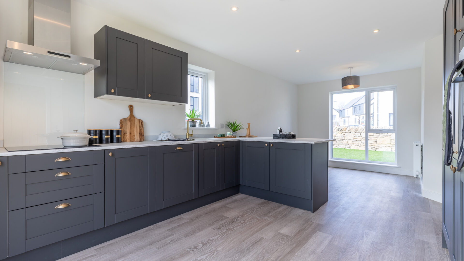 The open plan kitchen/dining area in the 3-bedroom Sedgwick at Meadow Rigg in Kendal - Genesis Homes
