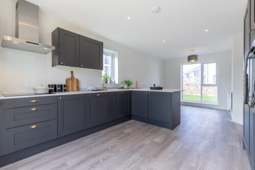 The open plan kitchen/dining area in the 3-bedroom Sedgwick at Meadow Rigg in Kendal - Genesis Homes