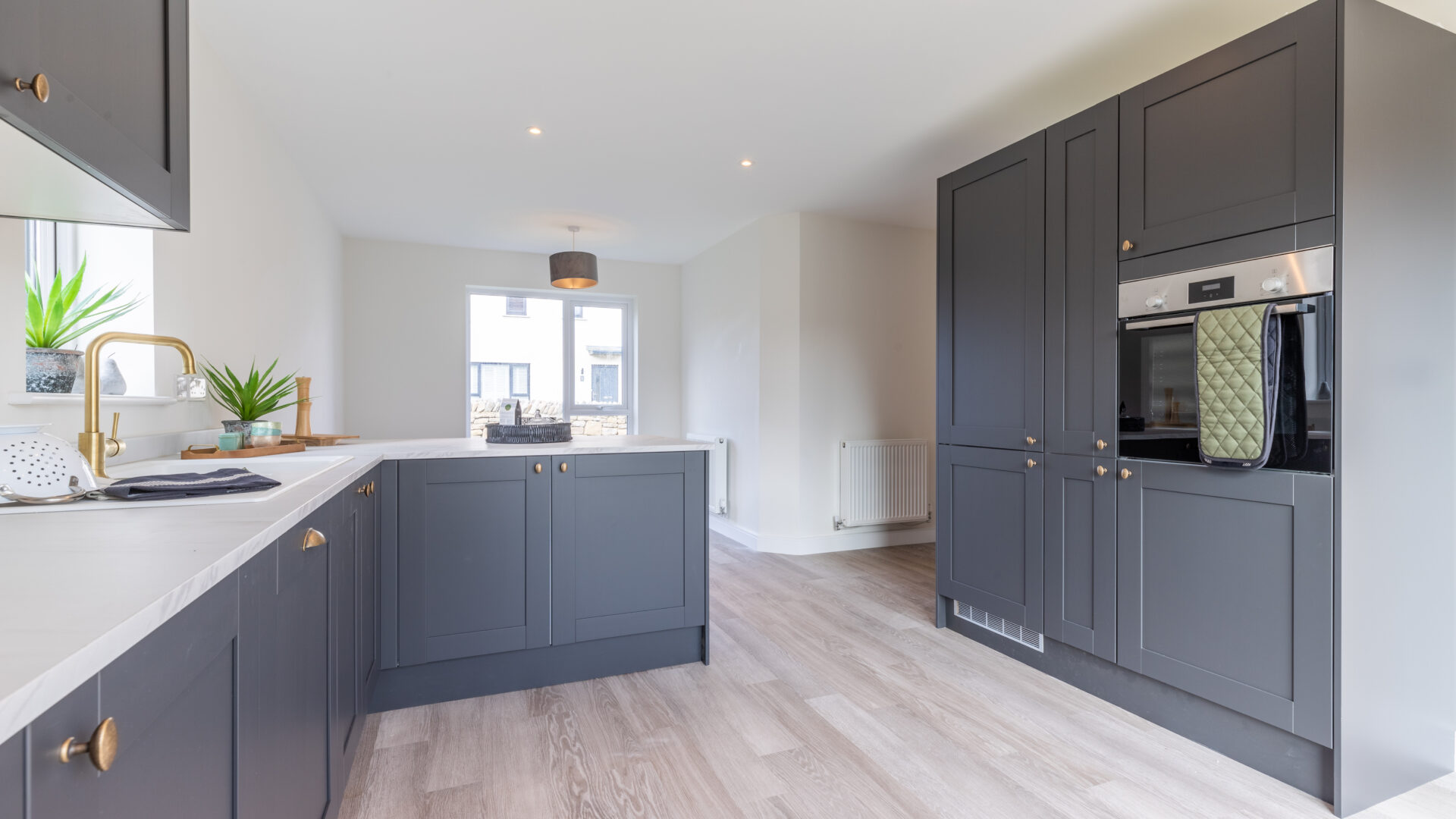 The open plan kitchen/dining area in the 3-bedroom Sedgwick at Meadow Rigg in Kendal - Genesis Homes