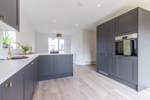 The open plan kitchen/dining area in the 3-bedroom Sedgwick at Meadow Rigg in Kendal - Genesis Homes