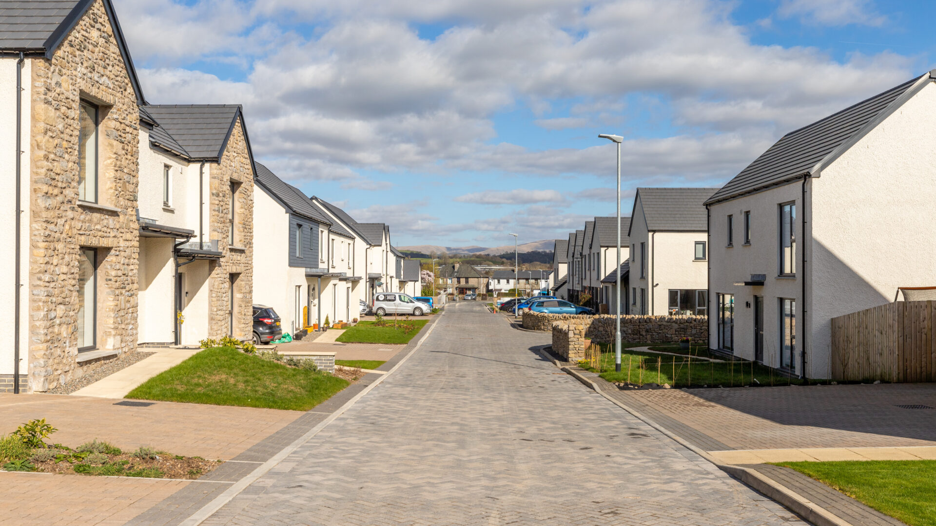 Street scene image of new build development, Meadow Rigg in Kendal - Russell Armer by Genesis Homes