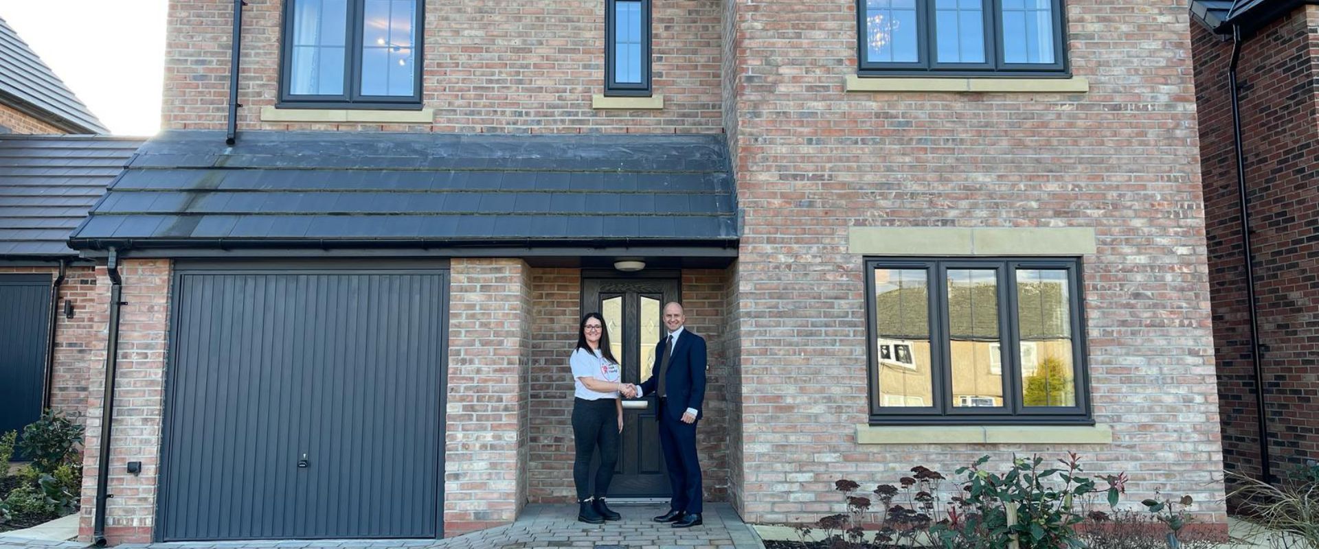 Donna Mills from CRY for Eden with Nicky Gordon MD of Genesis Homes