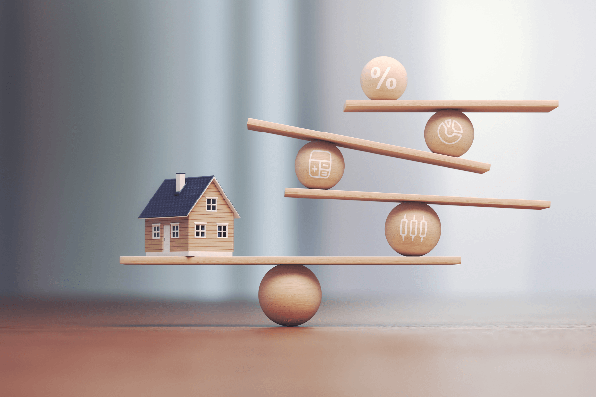 Wooden model house balancing on wooden planks with house related icons on