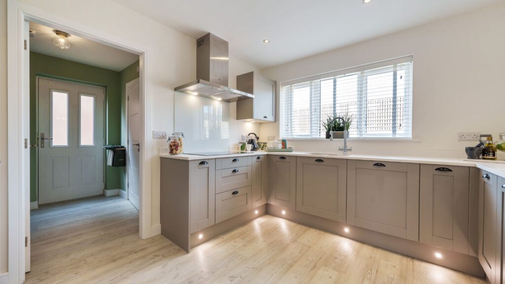 Modern and sleek kitchen from Genesis Homes with undercupboard lighting