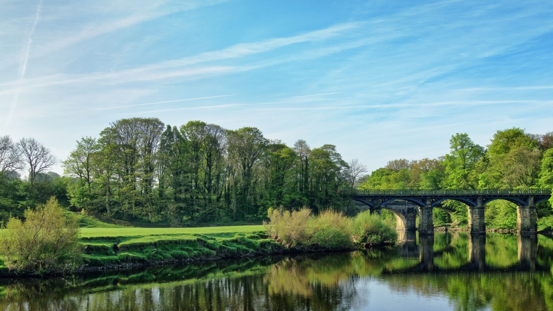 Looking over the river Lune, Lancaster, towards trees and a bridge
