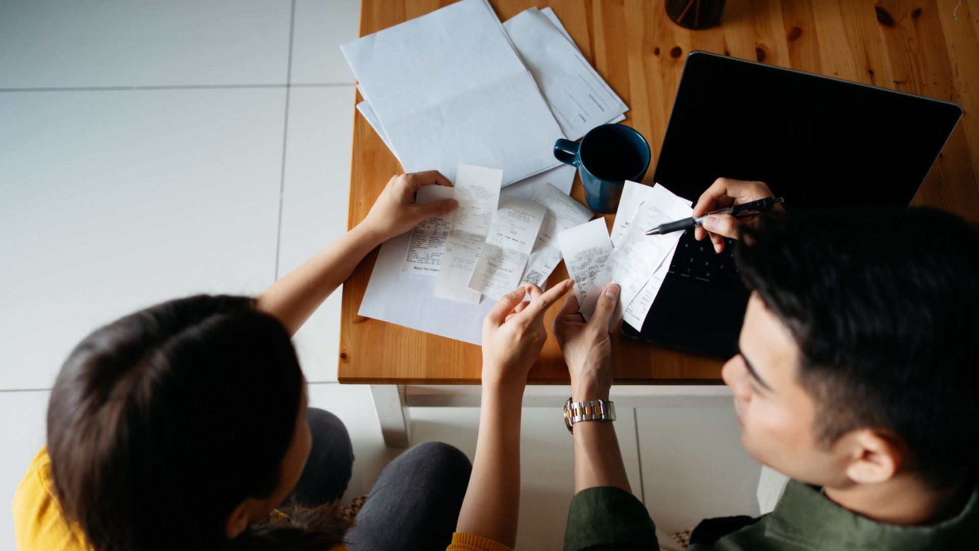 Couple managing their spending to budget for a house deposit