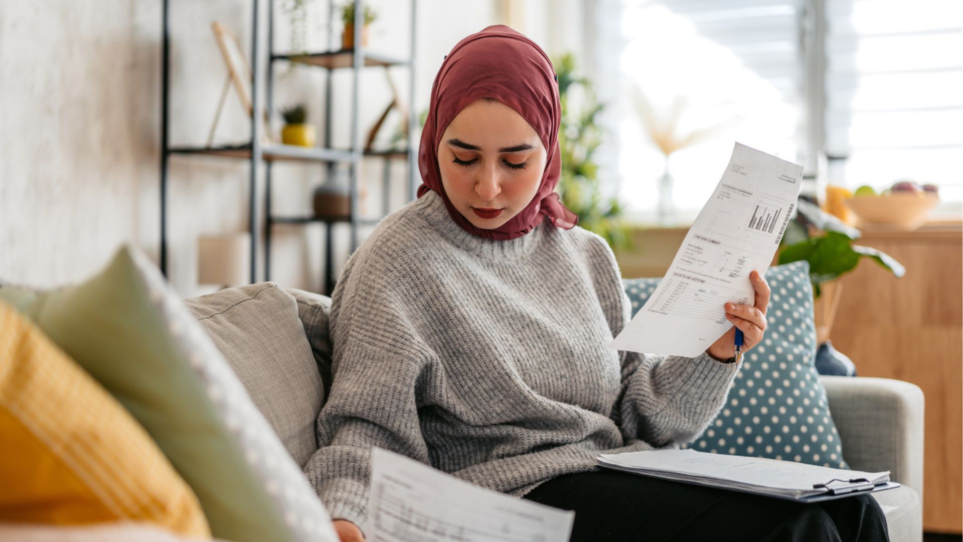 Woman reviwing her finances to save for a house deposit