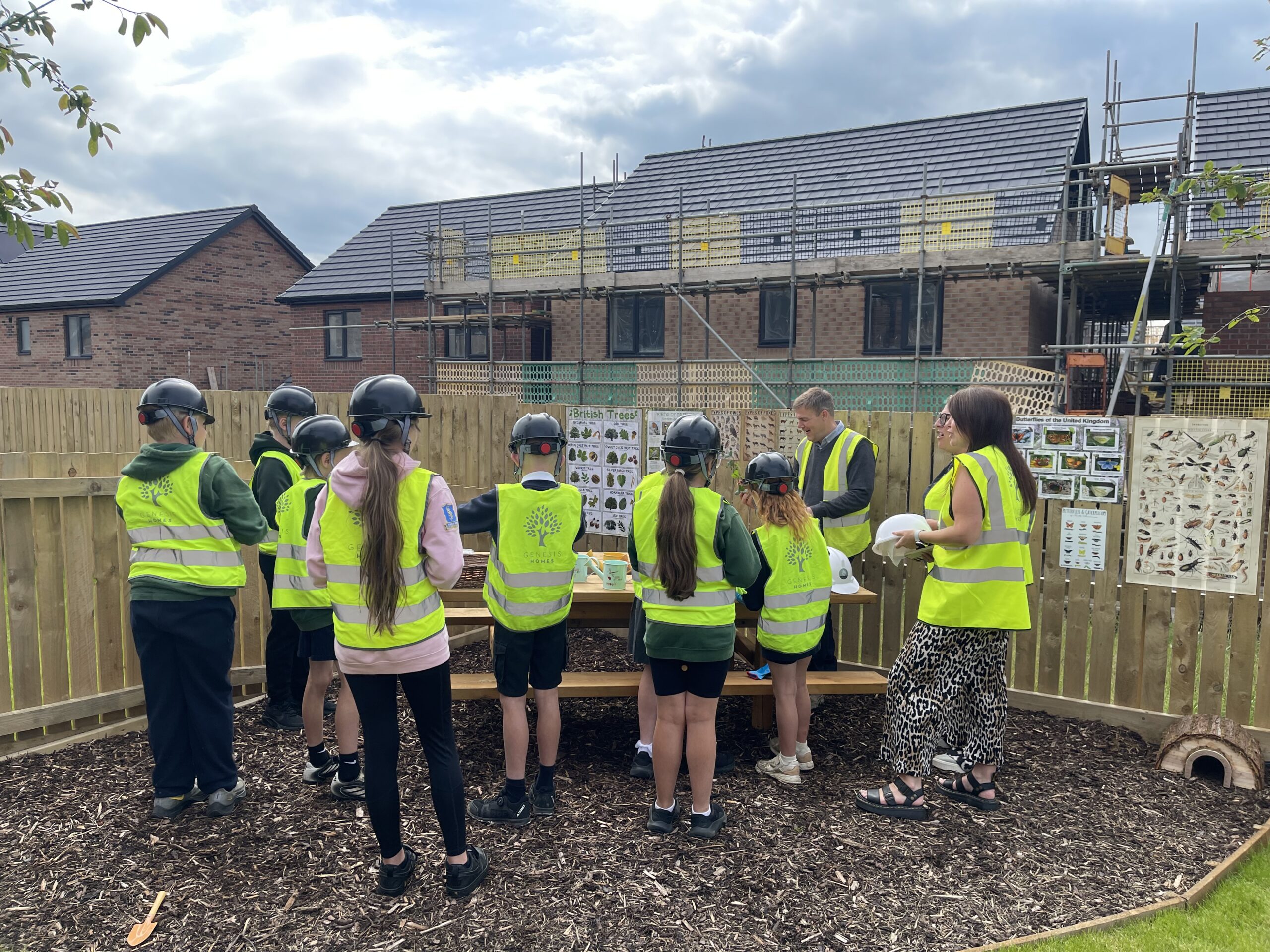 St Paul's School pupils planting in show home garden at Genesis Homes development in Seaton