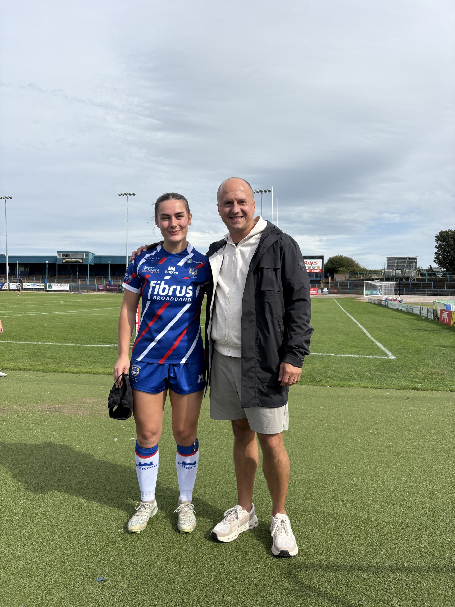 Nicky Gordon, Managing Director of Genesis Homes, and Josie Scrimgour, Planning & Pre-Development Manager at Genesis Homes on the pitch for Workington Town Ladies Rugby League